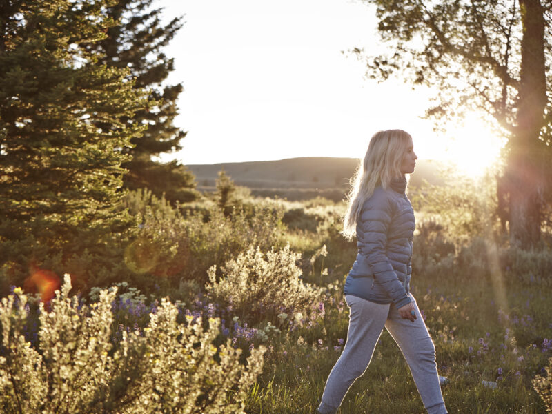 Girl walking in meadow in Jackson Hole