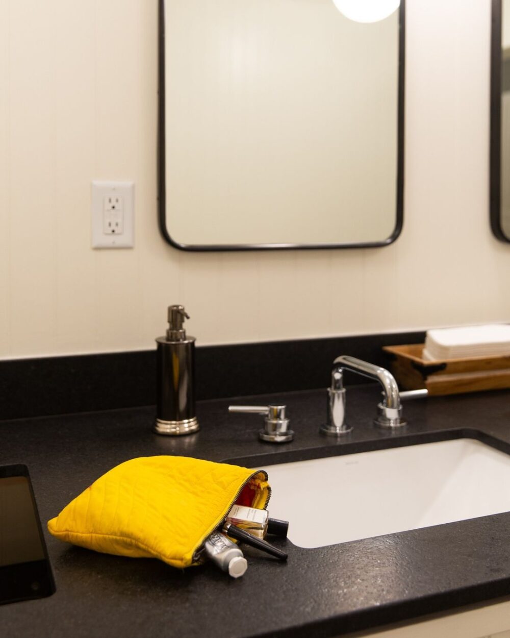 bathroom counter with makeup bag