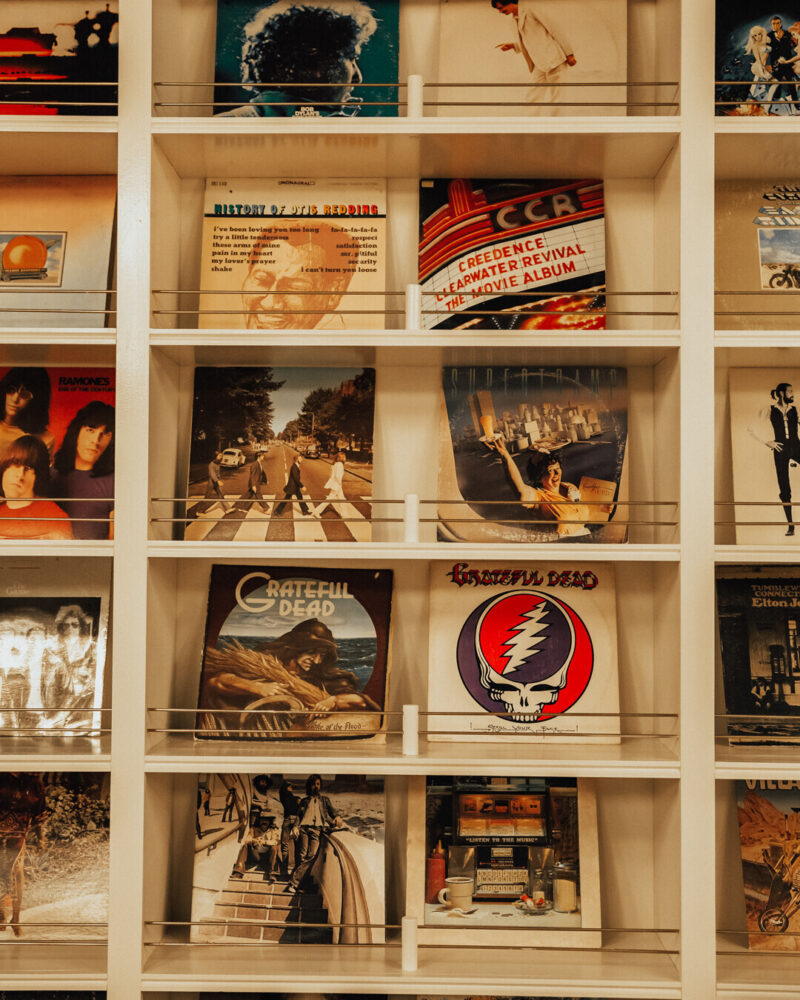 Cache House wall of records bookshelf