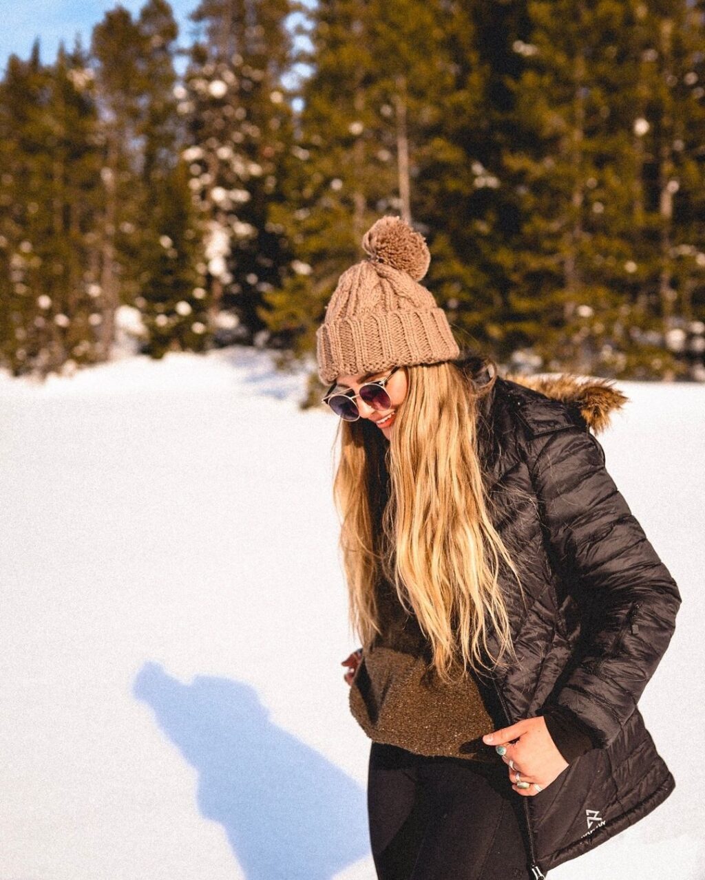 girl walking in mountains with snow