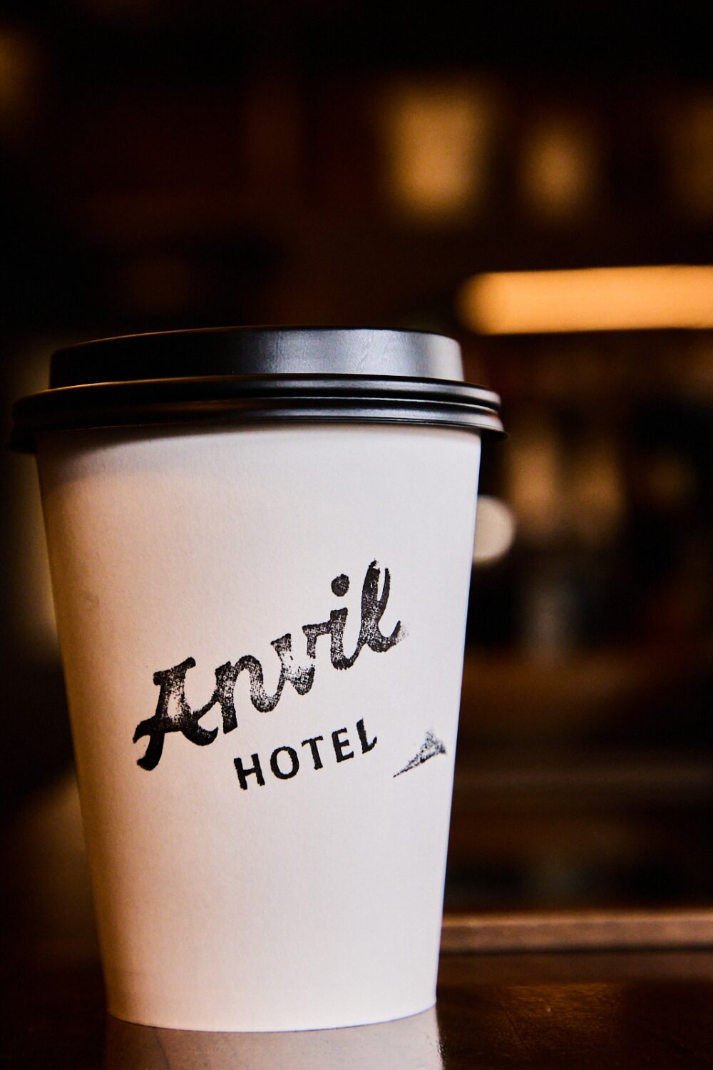 An Anvil Hotel disposable coffee cup.