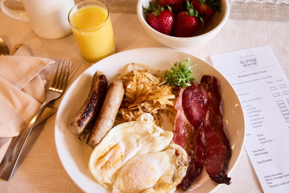 A breakfast of eggs, bacon, hash browns and sausages at The Alpine House, Jackson.