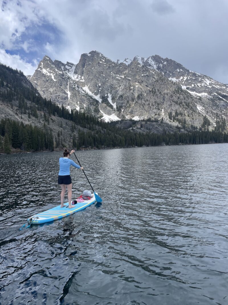 A woman paddleboarding in Jackson, Wyoming.